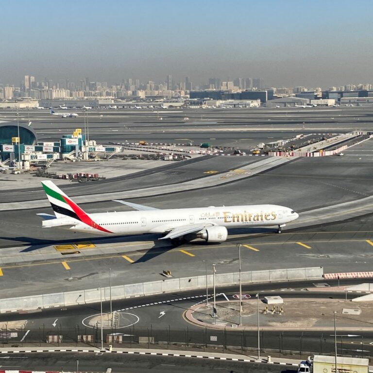 An excited Indian tourist arrives in Dubai, ready to explore the city.