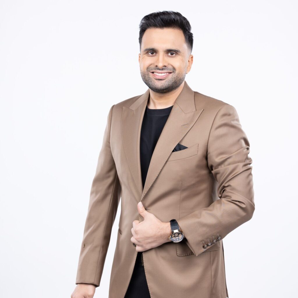 Portrait of Adel Sajan in formal attire, representing his innovative leadership at Danube Group.