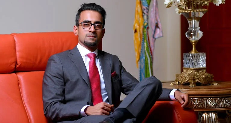 Portrait of Ganesh Pillai in formal attire, representing his leadership in business transformation.