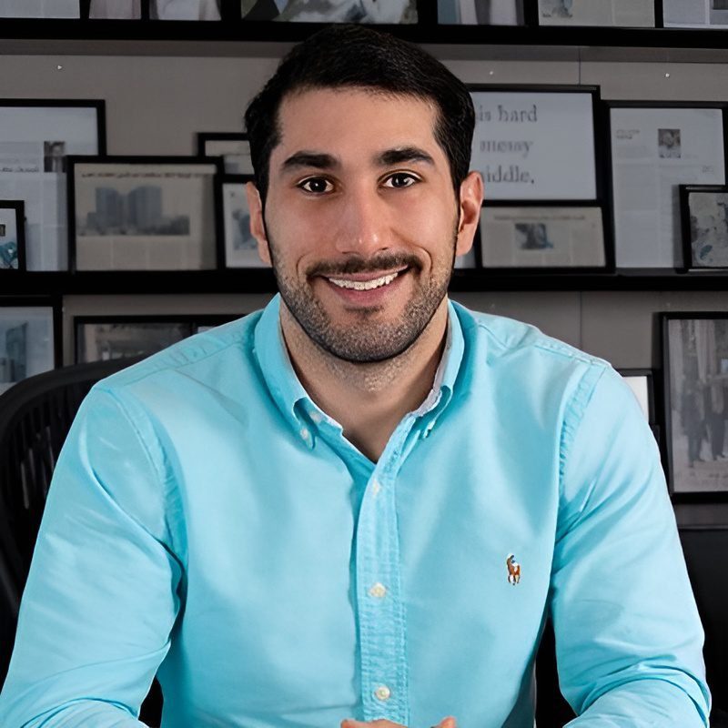 Portrait of George Khouzami in formal attire, representing his leadership in Sharjah’s real estate sector.