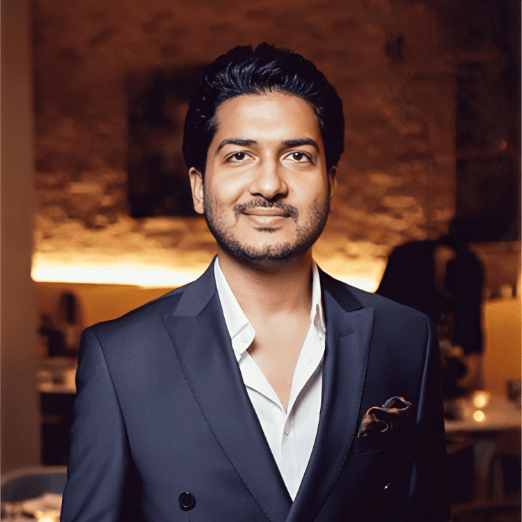 Portrait of Kunal Lahori in formal attire, representing his diverse leadership in real estate, facilities management, and hospitality.