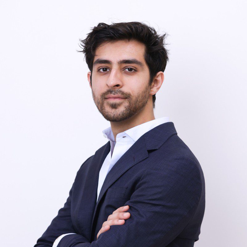 Portrait of Kush Bhatia in formal attire, representing his pioneering leadership in the global steel industry.