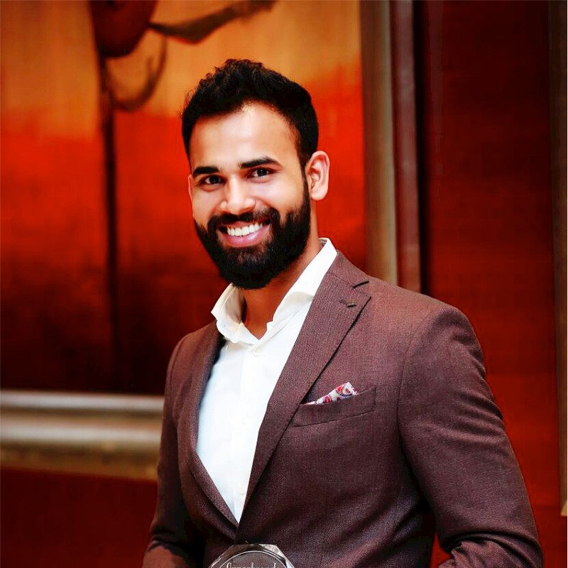 Portrait of Nawas Basheer in formal attire, representing his innovative leadership in transforming retail operations.