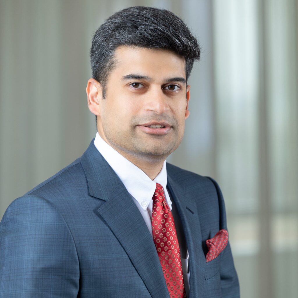 Portrait of Ravi Menon in formal attire, symbolizing his transformative leadership in the global real estate sector.