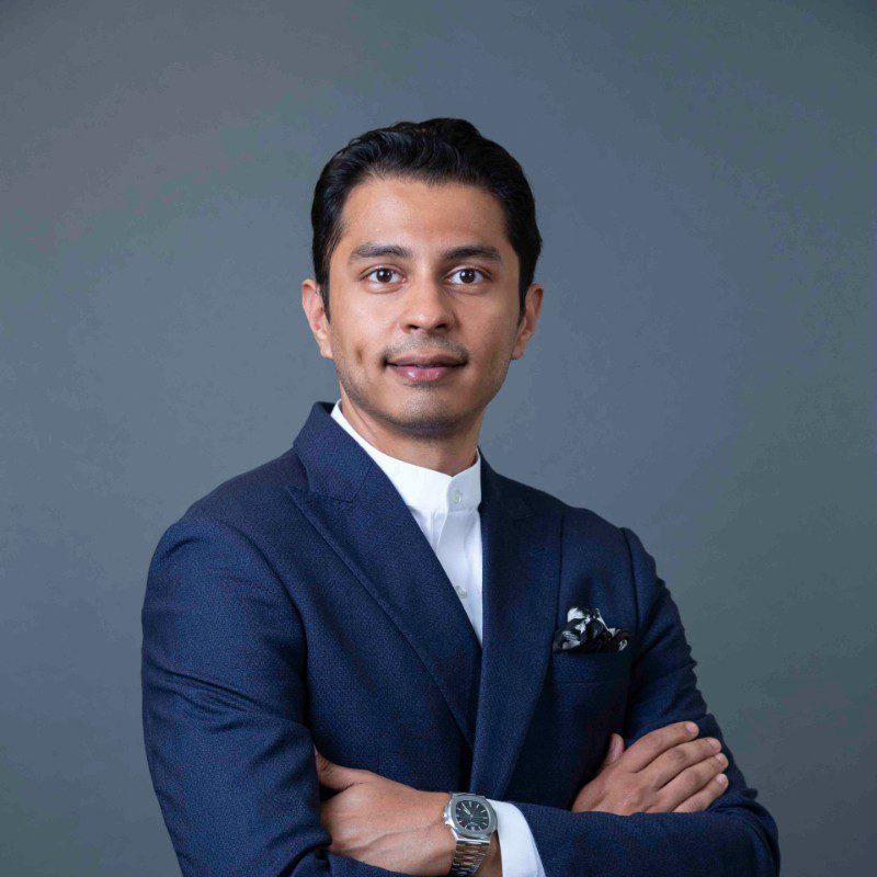 Portrait of Rohan Mehta in formal attire, symbolizing his transformative leadership in global chemical distribution.