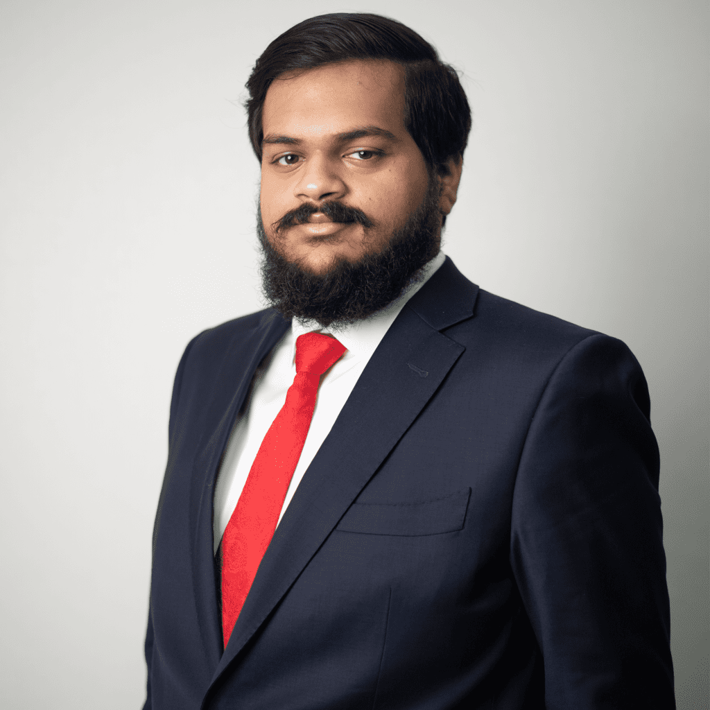 Portrait of Rohit in formal attire, representing his leadership in digital innovation and strategic operations at Adil Trading.