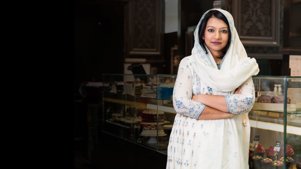 Portrait of Shafeena Yusuff Ali in formal attire, representing her leadership in business innovation and cultural enrichment.