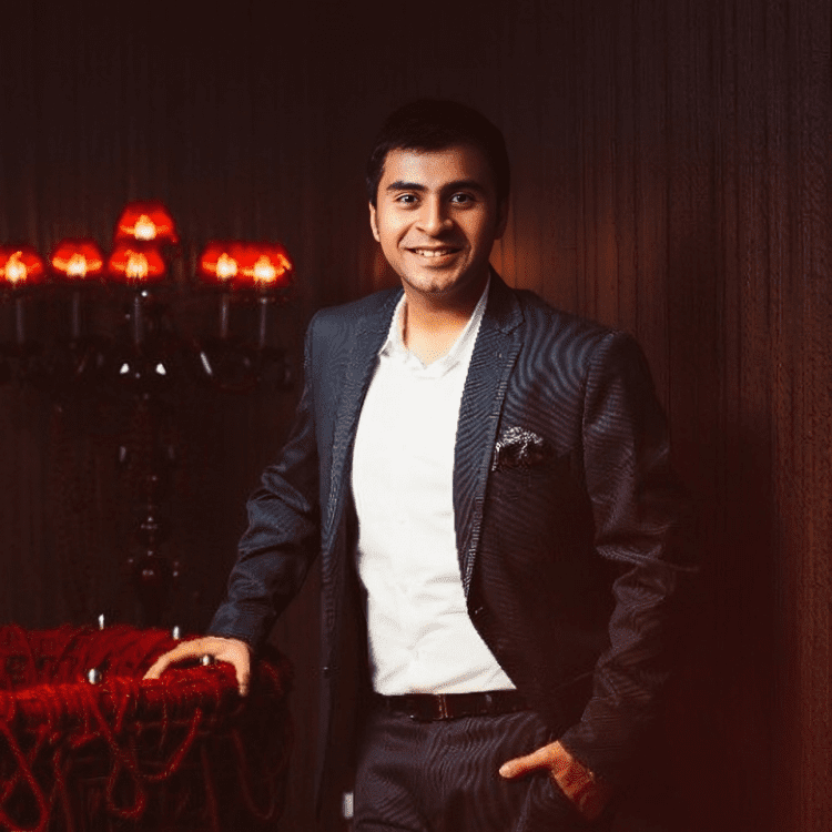 Portrait of Vivek Bhatia in formal attire, symbolizing his transformative leadership in the sustainable steel industry.