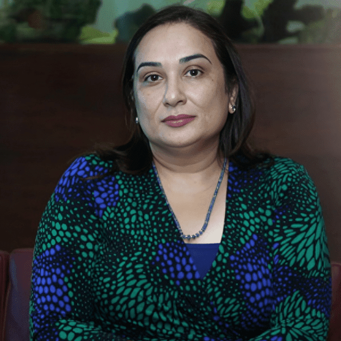 Portrait of Zanubia Shams in formal attire, representing her transformative leadership in healthcare and social responsibility.