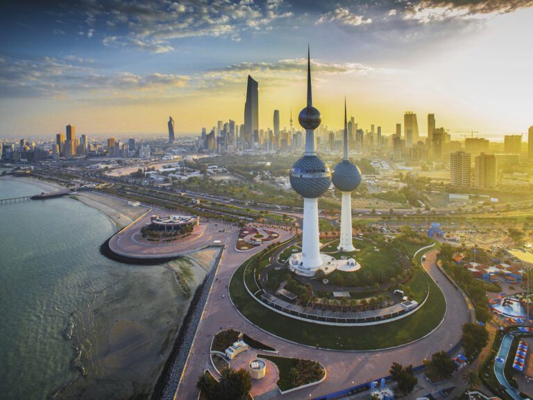 Kuwait skyline with festive Eid decorations symbolizing the public holiday