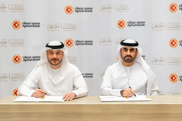 Ajman Bank and Finance Department in Ajman Partner to Drive Digital Integration Ajman Bank and Finance Department officials shaking hands to mark digital integration partnership